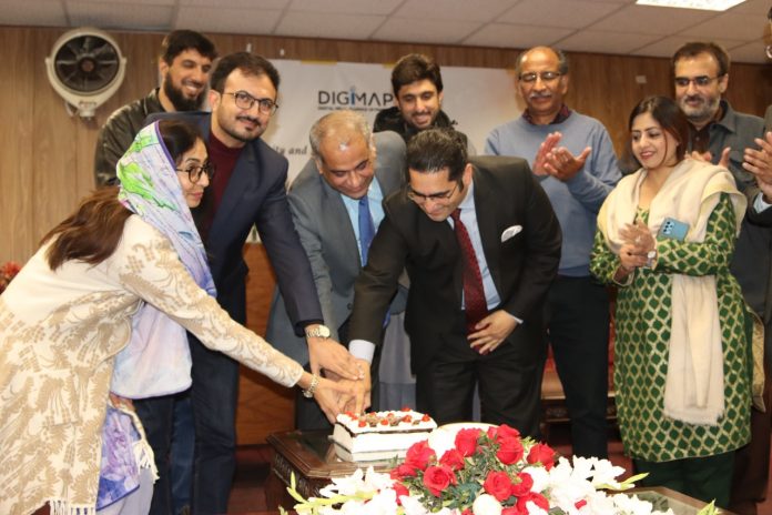 Mr Lal Chand Malhi, Parliamentary Secretary on Human Rights in Pakistan, cuts the cake to mark the first anniversary of DigiMap in Islamabad.